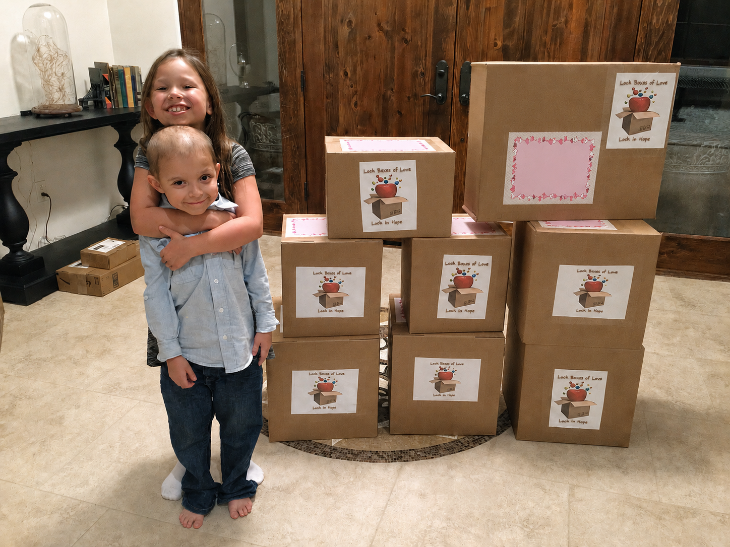 Emma and Chase with the first Lock Boxes of Love